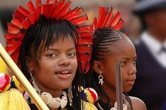 Members of the Swazi Royal Family, indicated by red feathers in their head dress, at the annual reed dance ceremony.
